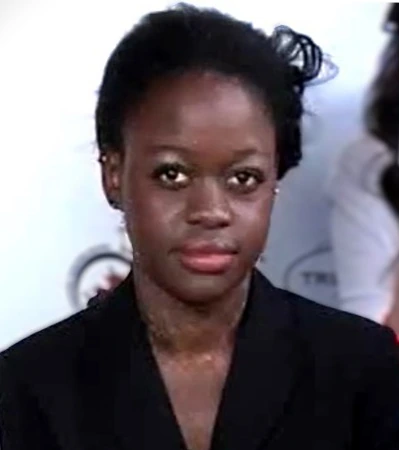 Portrait photo of Michaela DePrince at an event, wearing a dark jacket and looking at the camera.